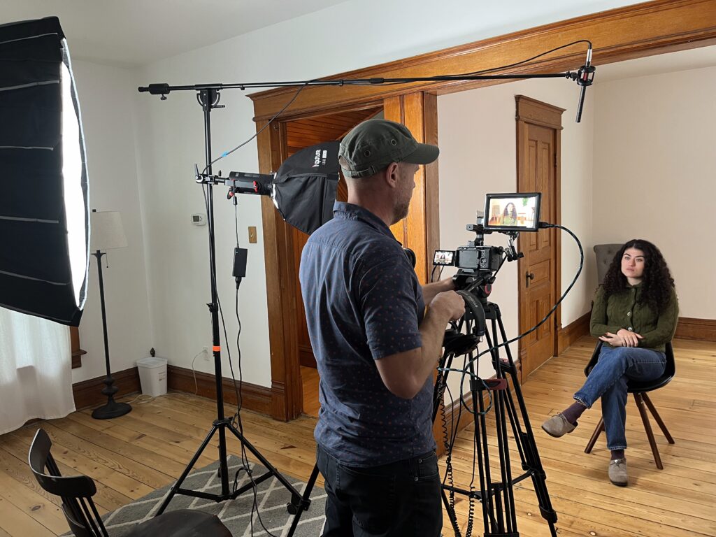 film director interviewing woman on camera