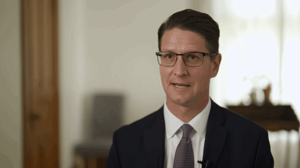 businessman giving an interview, seated in a home studio setting